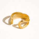 Maison Ella Elowen crossover ring in polished 18k gold plated stainless steel with a textured interwoven design