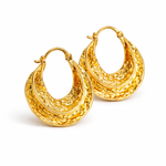 Gold swirl hoop earrings, worn