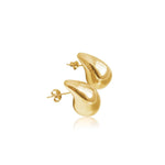 Gold oversized droplet huggie earrings, worn