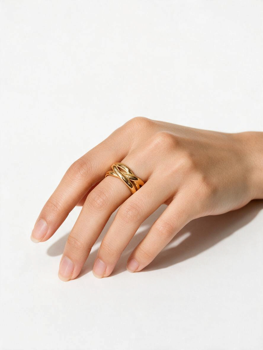 Maison Ella Elowen Crossover Ring in polished 18k gold plated stainless steel worn on a hand