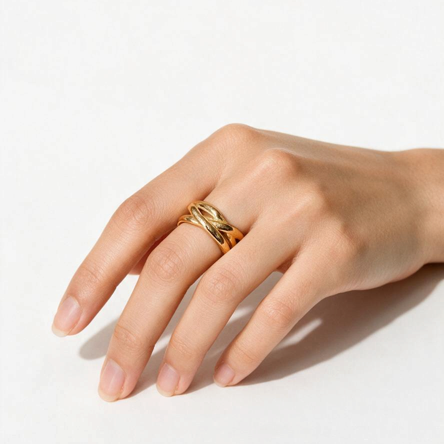 Maison Ella Elowen Crossover Ring in polished 18k gold plated stainless steel worn on a hand