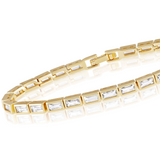 Maison Ella Lainey tennis bracelet featuring clear cubic zirconia stones in gold-tone rectangular bezels.