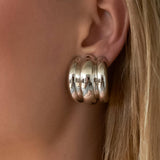 Bold spiral earrings featuring a sculptural layered silhouette that creates fluid movement and modern elegance. Crafted from premium stainless steel with 18K gold plating. Hypoallergenic, water- and tarnish-resistant—perfect for adding a statement twist to any look.