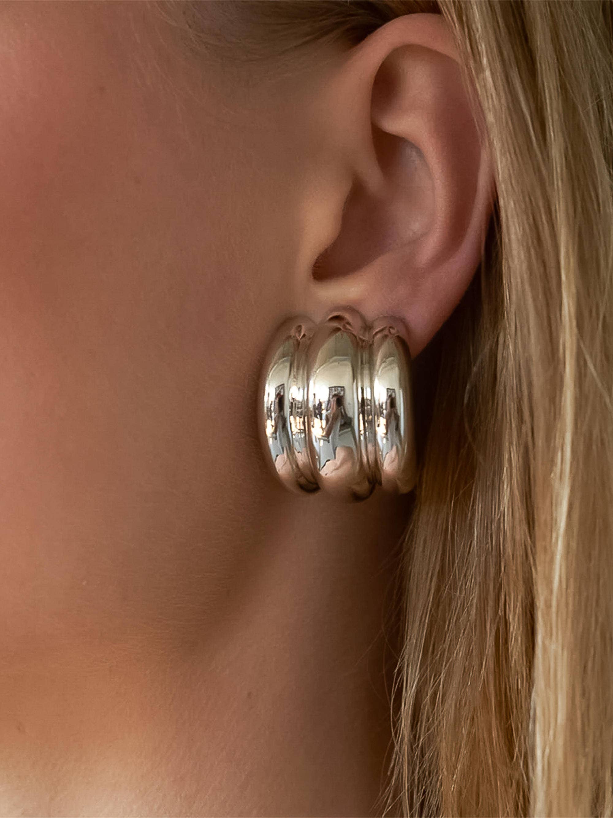 Bold spiral earrings featuring a sculptural layered silhouette that creates fluid movement and modern elegance. Crafted from premium stainless steel with 18K gold plating. Hypoallergenic, water- and tarnish-resistant—perfect for adding a statement twist to any look.
