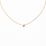 Gold heart-shaped pendant necklace on a white background