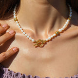 Choker necklace featuring natural baroque pearls with organically varied shapes, finished with an 18K gold-plated clasp. Measures 16 inches with a 2-inch extender. Hypoallergenic, water- and tarnish-resistant—perfect for adding timeless elegance and modern sophistication to any jewellery rotation