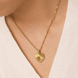 Classic heart pendant necklace crafted from 18K gold-plated stainless steel, featuring a refined chain measuring 16.14 inches with a 1.97-inch extender. Romantic, minimalist, and timeless—perfect for adding tender elegance to any look. Hypoallergenic, water- and tarnish-resistant.