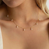 Dainty necklace crafted from stainless steel for lasting shine and strength, featuring soft oval imitation pearls that dangle gracefully along the chain. Hypoallergenic, water- and tarnish-resistant—perfect for adding a soft, romantic touch to any outfit.