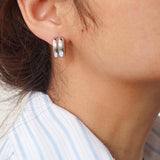 Double C-hoop earrings crafted from premium stainless steel, featuring a bold yet refined silhouette with a 0.6-inch diameter. Hypoallergenic, water- and tarnish-resistant—perfect for adding modern, versatile edge to any everyday look.