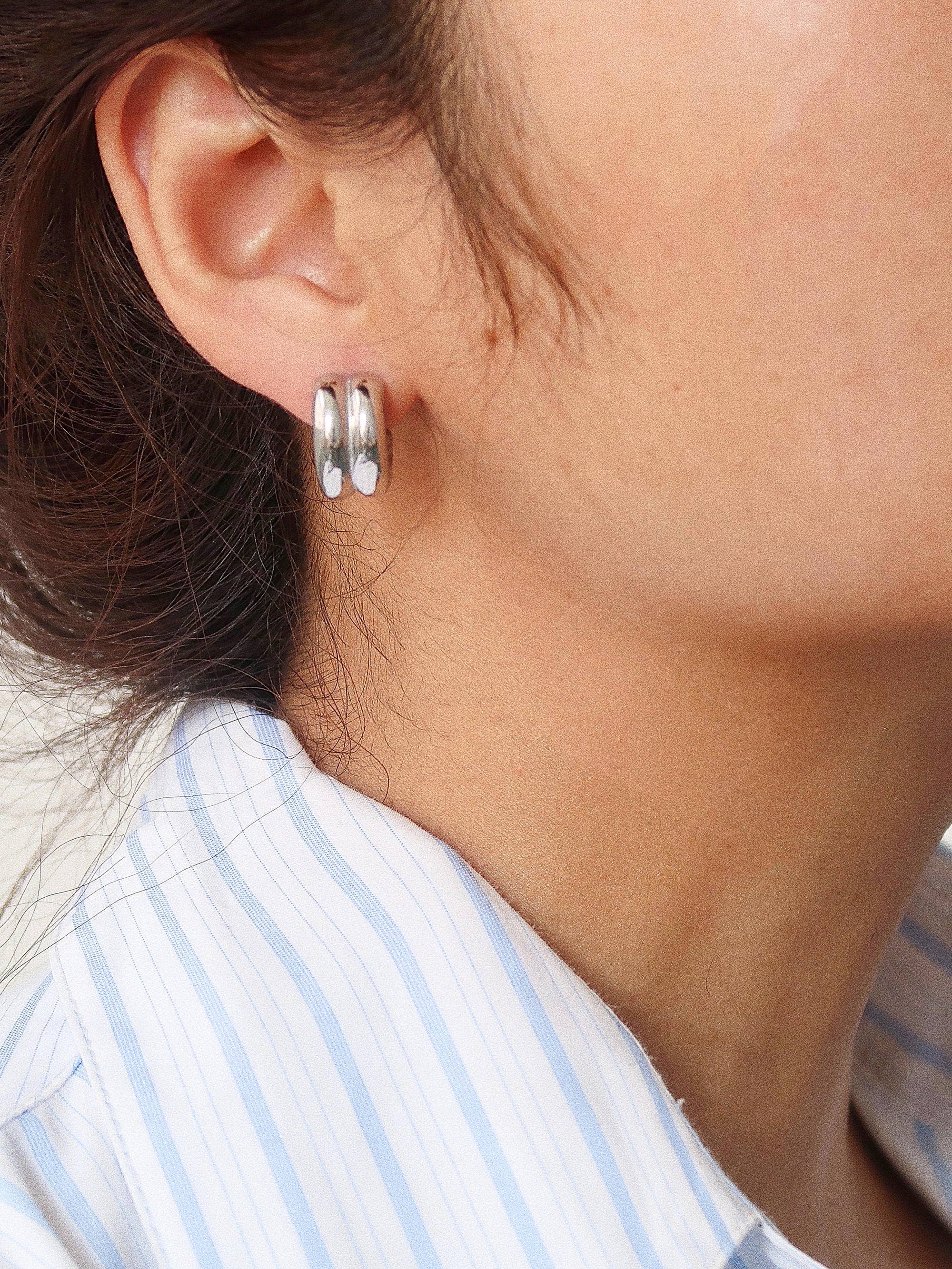 Double C-hoop earrings crafted from premium stainless steel, featuring a bold yet refined silhouette with a 0.6-inch diameter. Hypoallergenic, water- and tarnish-resistant—perfect for adding modern, versatile edge to any everyday look.