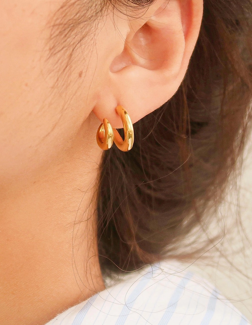 Modern double hoop earrings crafted from premium stainless steel, featuring interlocking double-C design for a structured look. Diameter 0.6 inches. Contemporary, versatile, and chic—perfect for elevating any outfit with bold yet refined style. Hypoallergenic, water- and tarnish-resistant.