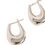 Gold droplet hoop earrings with a gently curved silhouette and smooth, polished finish. Crafted from 18K gold-plated brass, measuring 1 x 0.7 inches. Hypoallergenic, water- and tarnish-resistant—ideal for effortless everyday elegance.