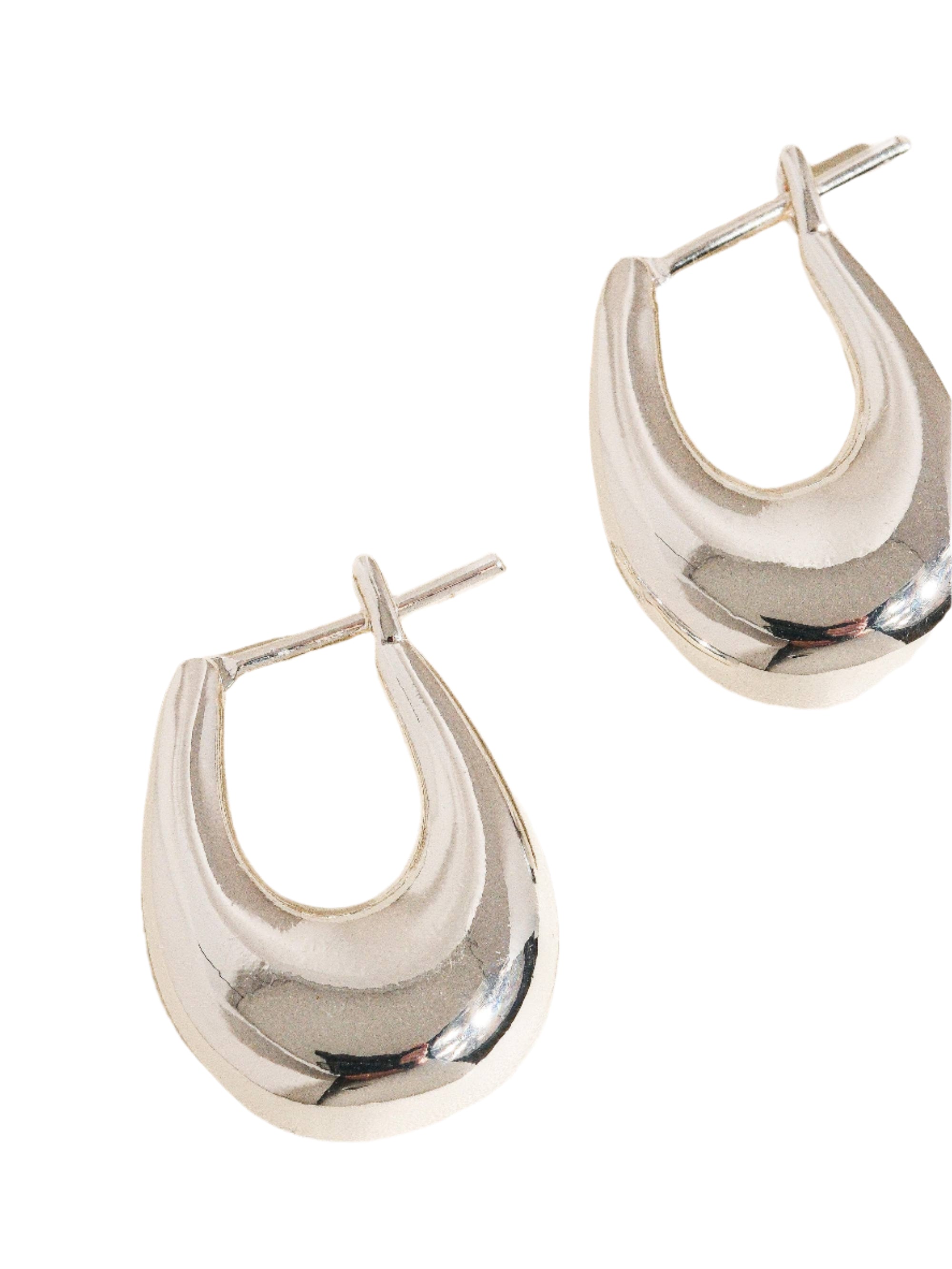 Gold droplet hoop earrings with a gently curved silhouette and smooth, polished finish. Crafted from 18K gold-plated brass, measuring 1 x 0.7 inches. Hypoallergenic, water- and tarnish-resistant—ideal for effortless everyday elegance.