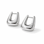 Geometric silver hoop earrings, worn