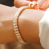 Elegant bracelet crafted from stainless steel with 18K gold plating, featuring high-quality cubic zirconia for brilliant sparkle. Chain length 6.8 inches with extender for adjustable fit. Hypoallergenic, water- and tarnish-resistant—perfect for adding instant shine and effortless elegance to any stack.