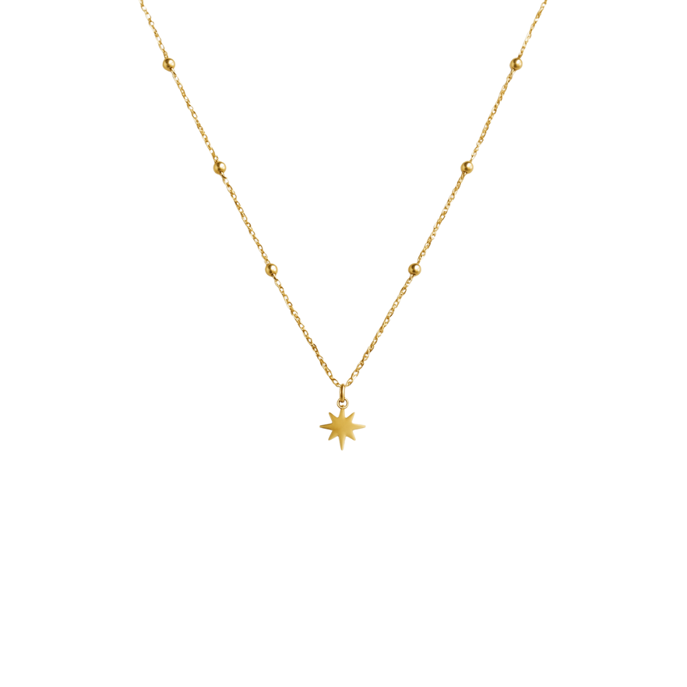Gold necklace with a star pendant on a white background