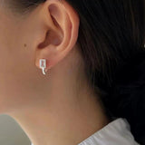 Elegant square stud earrings crafted from certified 925 sterling silver or plated gold, featuring sparkling square-cut zircon stones. Hypoallergenic, water- and tarnish-resistant—perfect for adding timeless sparkle and refined romance to any jewellery collection.