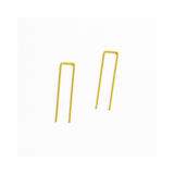 Gold metal hairpin clips on a white background