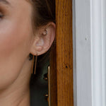 Minimalist staple earrings crafted from 14K gold fill for a sleek, polished finish. Lightweight and versatile—perfect for wearing in second piercings for a layered look or as a subtle, refined main accent. Hypoallergenic and tarnish-resistant.