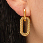 Modern hoop earrings crafted from stainless steel with your choice of 18K gold or silver plating, featuring a double chain detail for added edge and sophistication. Hypoallergenic, water- and tarnish-resistant—perfect for making a bold yet refined statement in any jewellery rotation.