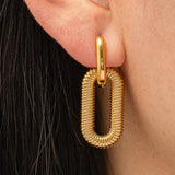 Modern hoop earrings crafted from stainless steel with your choice of 18K gold or silver plating, featuring a double chain detail for added edge and sophistication. Hypoallergenic, water- and tarnish-resistant—perfect for making a bold yet refined statement in any jewellery rotation.