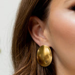 Statement earrings crafted from a sterling silver base with premium 18K gold plating, featuring a bold silhouette designed to turn heads. Hypoallergenic, water- and tarnish-resistant—perfect for adding effortless elegance from brunch to evening events.