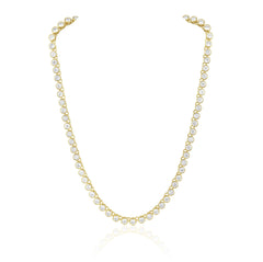 Elegant tennis necklace featuring a continuous line of sparkling cubic zirconia stones set in 18K gold-plated stainless steel. Designed for timeless sparkle with a modern edge, this hypoallergenic, water- and tarnish-resistant piece is perfect worn solo or layered for added glamour.