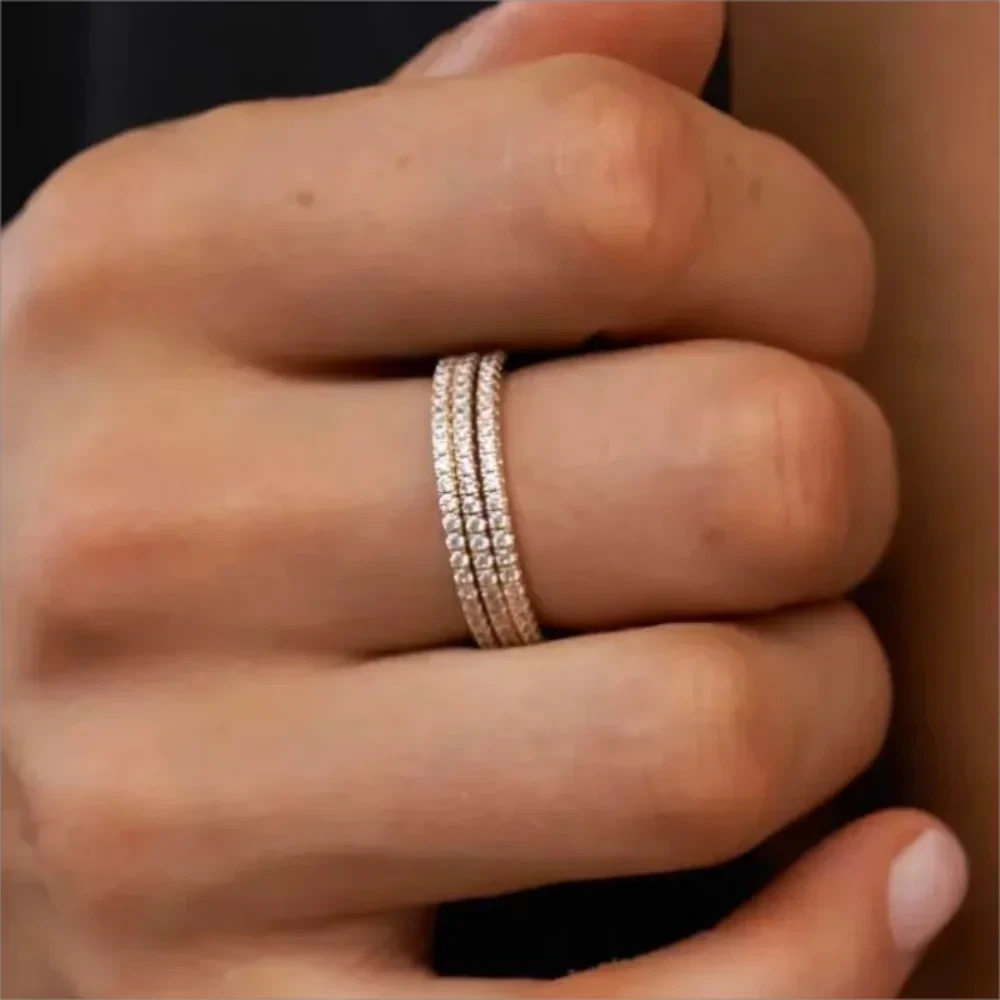 Minimalist full eternity band crafted from stainless steel with 18K gold plating, encrusted with shimmering cubic zirconia pavé all around. Hypoallergenic, water- and tarnish-resistant—perfect for effortless stacking or wearing solo for timeless sparkle.